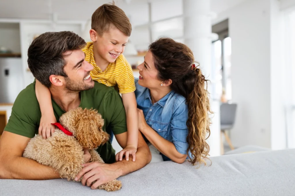 Happy family mother father young boy and dog